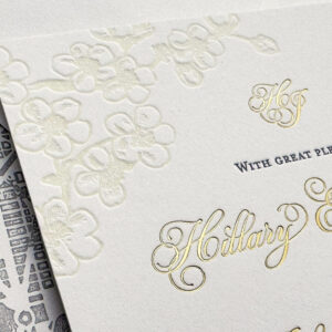 Cherry blossom invitation in letterpress and gold foil.
